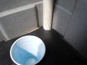 stand the pipe upright in one corner of the tub; you'll have to cut the plastic lid to make it fit