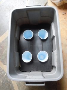 put the cups in the holes