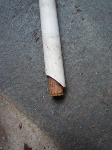 grab a wine cork that fits inside the pipe; impale it with a piece of stiff wire